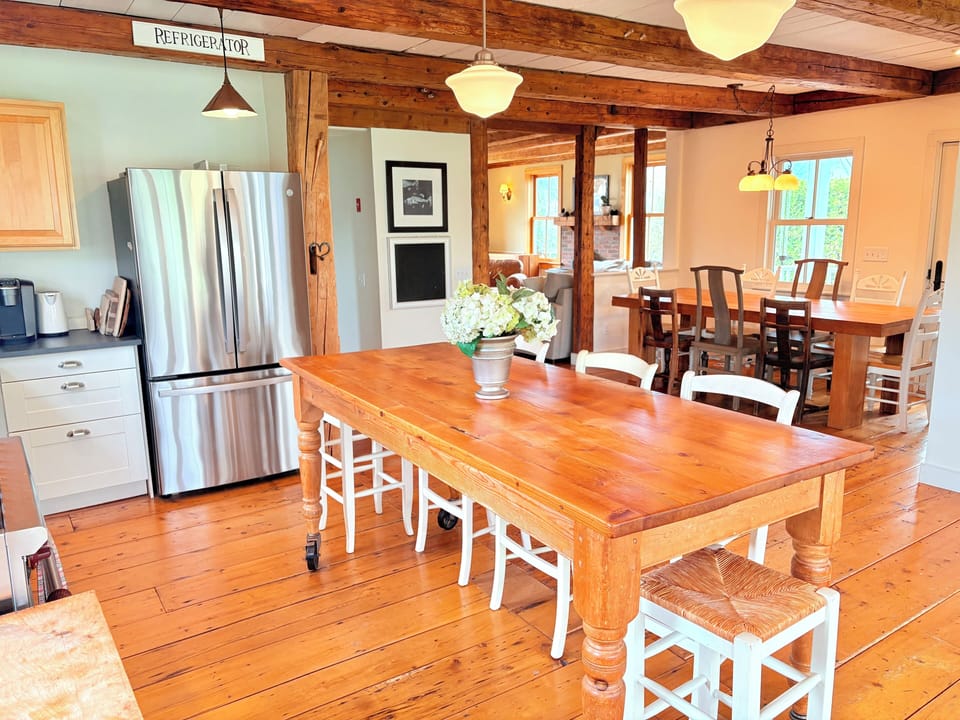 Kitchen island looking toward living room past dining area