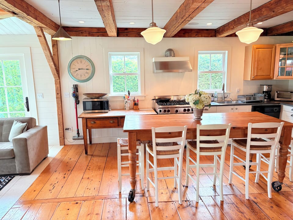 The kitchen is set up for socializing and features a Wolf range