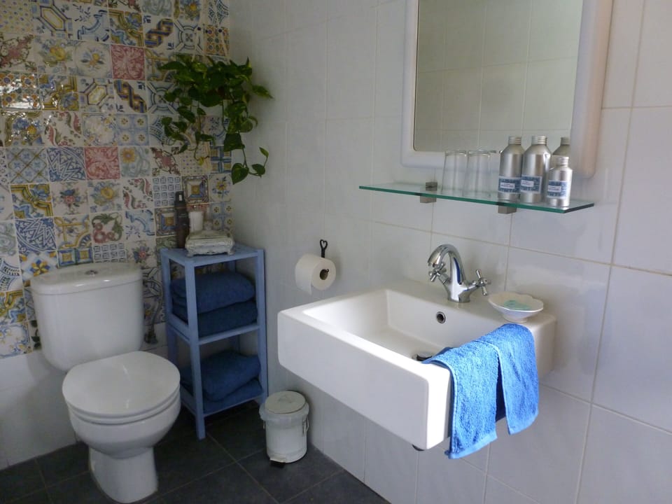 Bathroom with walk in shower, towels provided