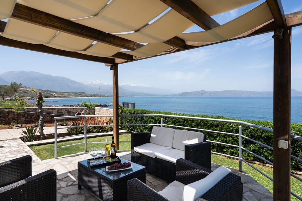 Charming outdoor space with seating for relaxation and delightful sea views.