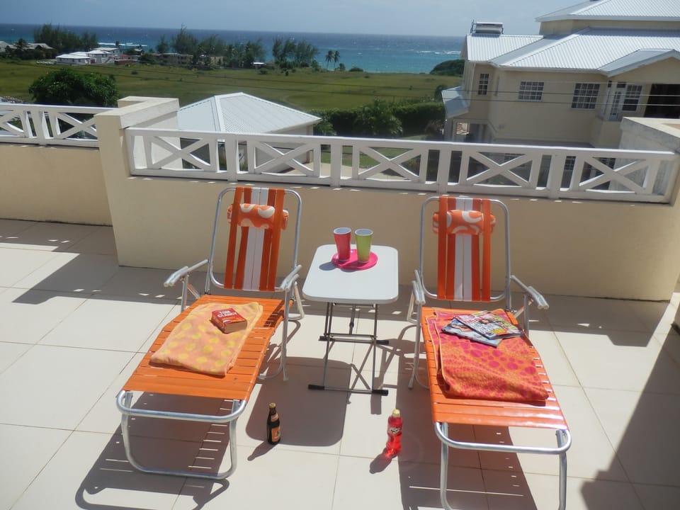 Relax by the pools on the roof terrace, enjoy the ocean view and cooling breeze