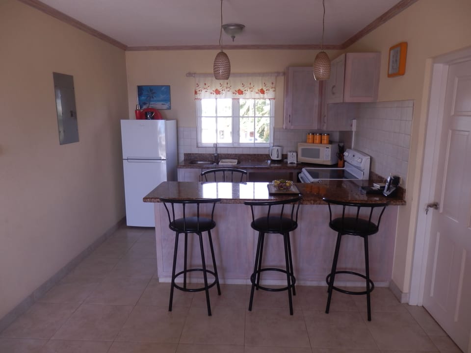 Kitchen/dining area.
Door leads to laundry room.