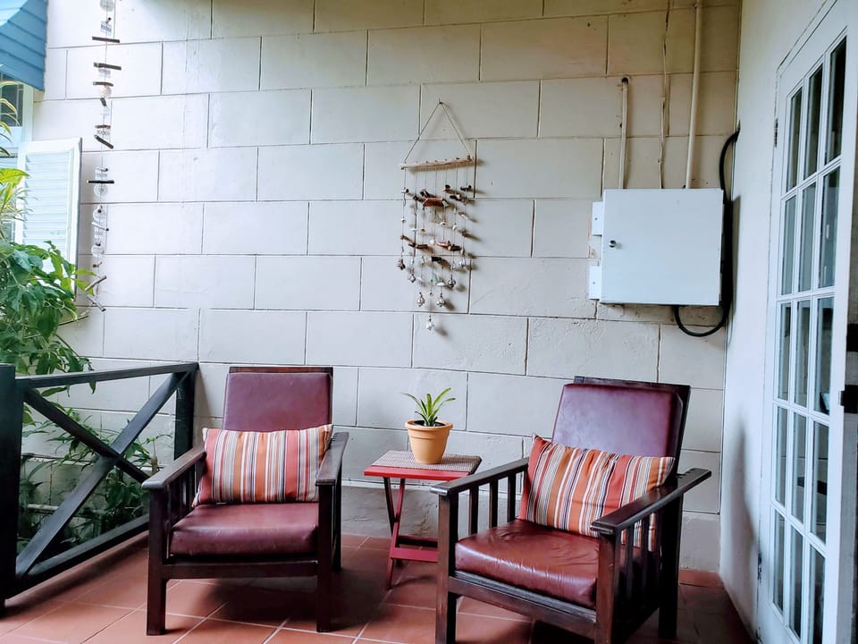 Cottage lounge chairs on covered deck