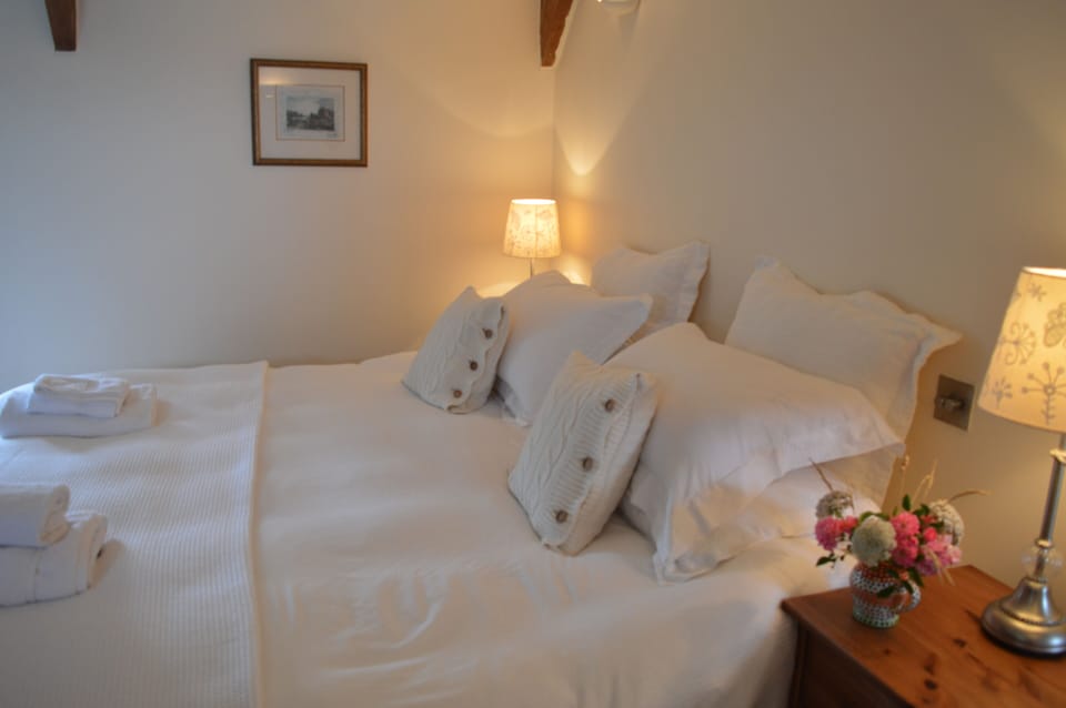 The super kingsize (and very comfy!) bed in the main upstairs bedroom