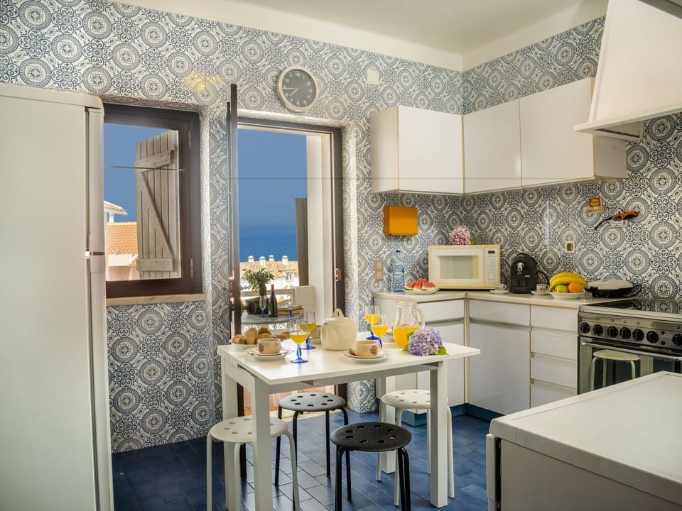 Room, Property, Interior Design, Furniture, Yellow, Blue, Building, Kitchen, Countertop, Wall