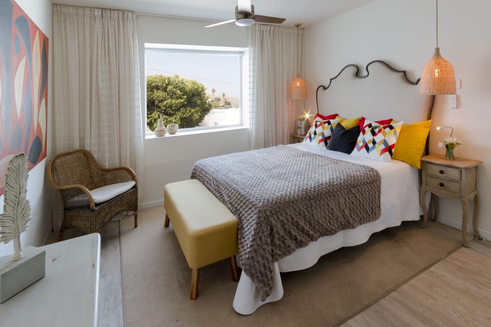 2 nd queen size bedroom with on suite and walk-in shower and sea views patio. 