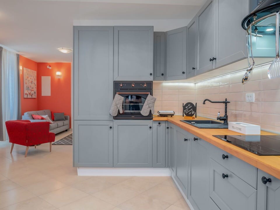 Room, Countertop, Property, Kitchen, Furniture, Cabinetry, Interior Design, Building, Floor, Yellow