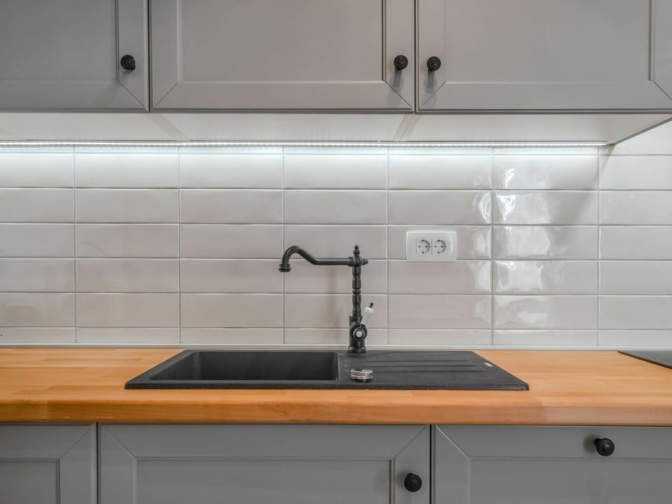 Tap, Cabinetry, Kitchen Sink, Countertop, Property, Sink, Plumbing Fixture, Furniture, Wood, Kitchen