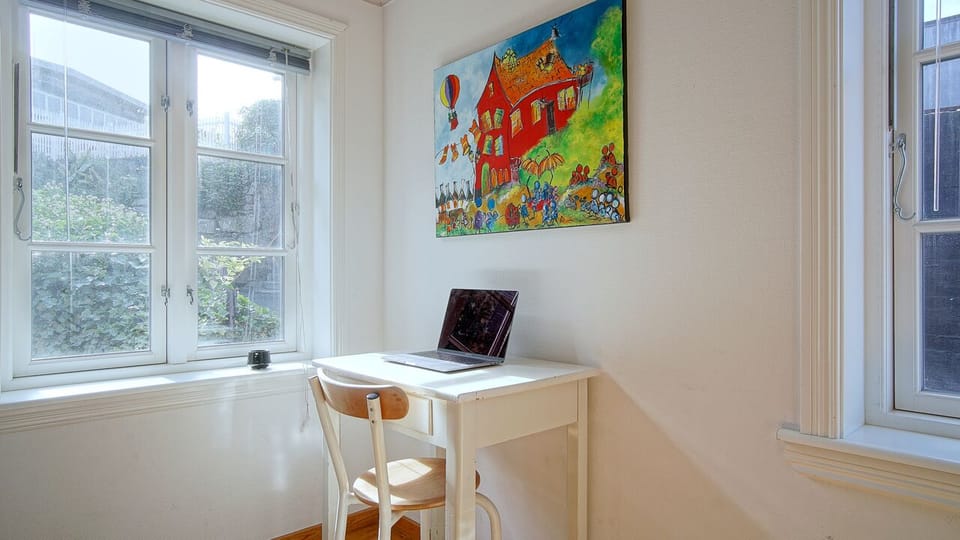 Room 1 with double bed and a desk for work. Located on ground floor. 