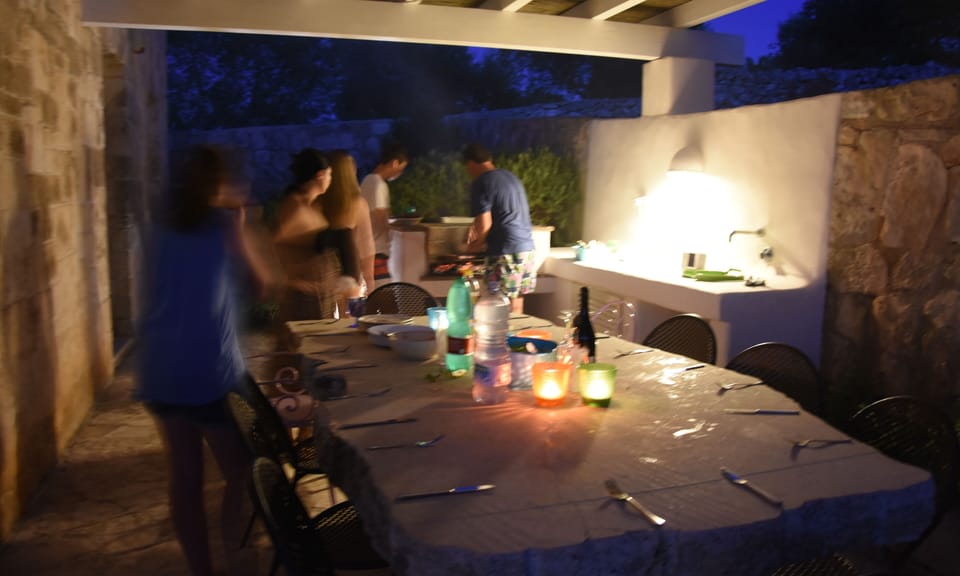 Barbecue in outside kitchen with stone table