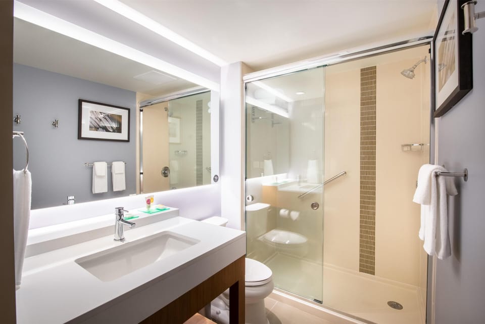 Designer toiletries, hair dryer, towels, soap