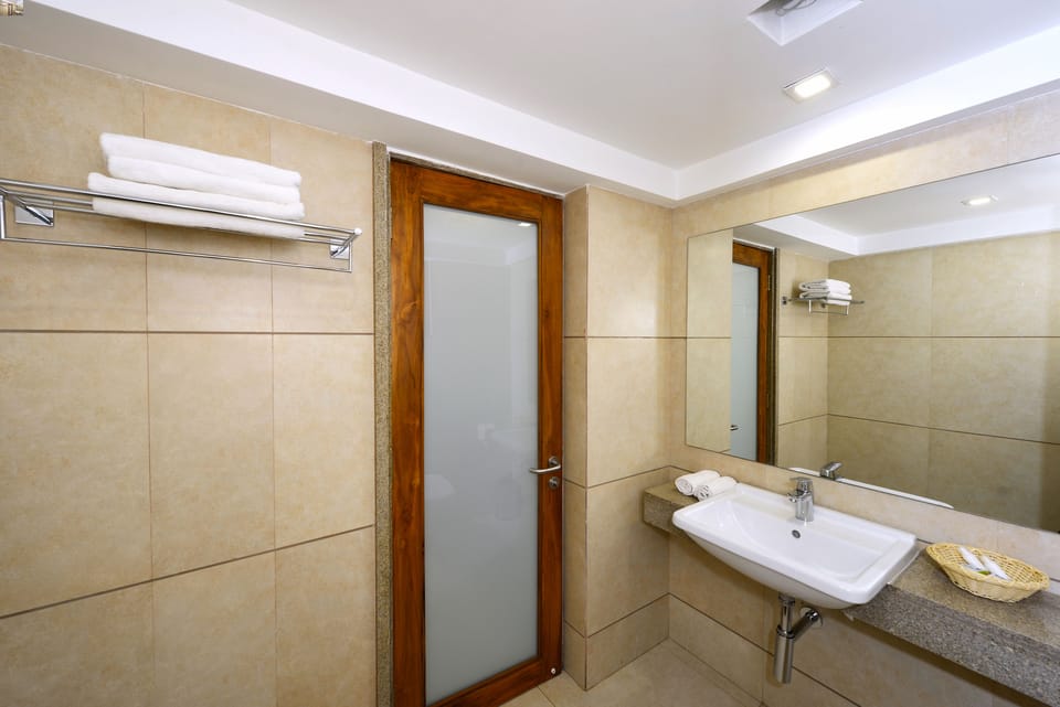 Shower, rainfall showerhead, designer toiletries, hair dryer