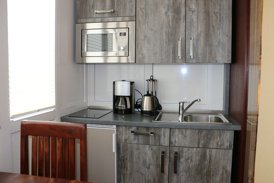 Coffee/tea maker, refrigerator (on request), microwave (on request)