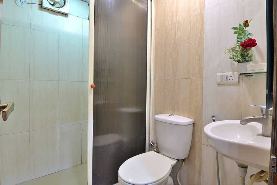 Shower, designer toiletries, hair dryer, slippers