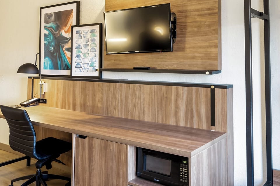 Desk, blackout drapes, iron/ironing board, free cribs/infant beds