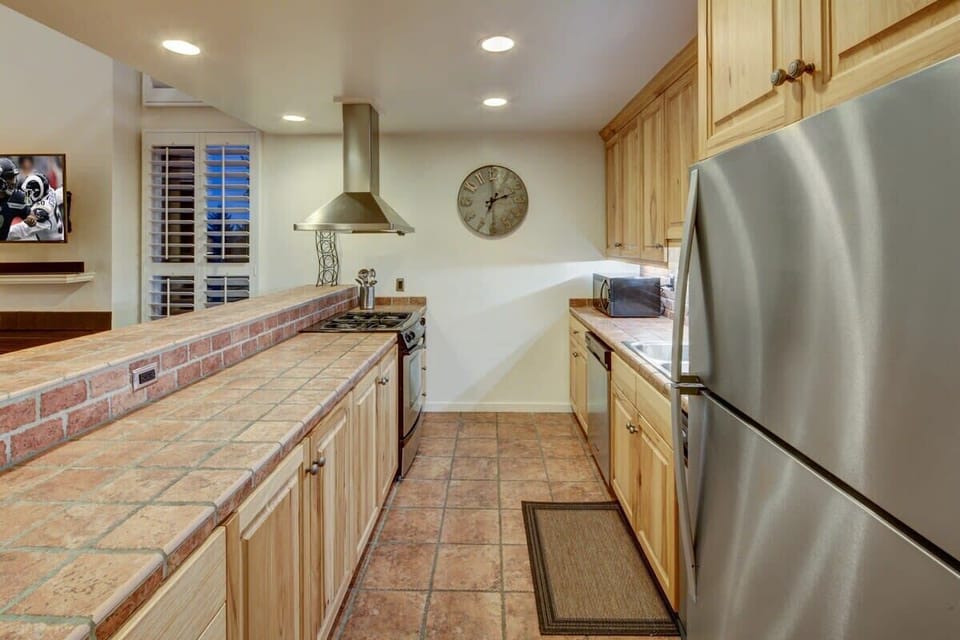 Kitchen - open to great room. Fully-equipped with breakfast bar seating.