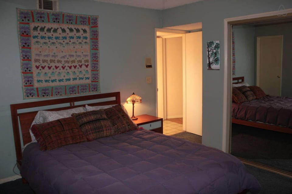 Bedroom with Queen bed and small private patio