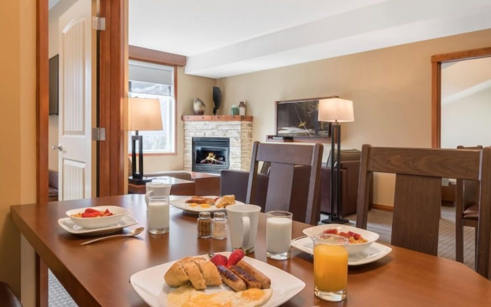 Cozy dining space set for a delightful meal, with a warm and inviting ambiance perfect for gathering.