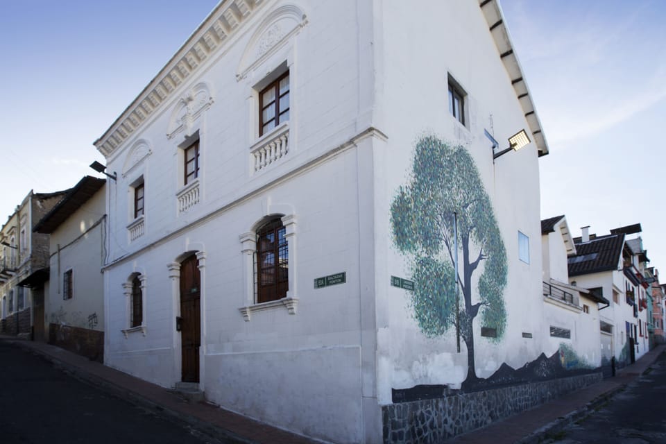 View of front and side facade of our house, with beautiful mural decoration.