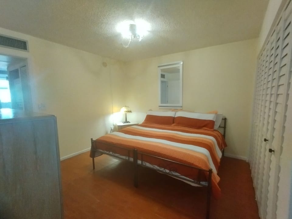 King Bed with night stand with convient phone charger.