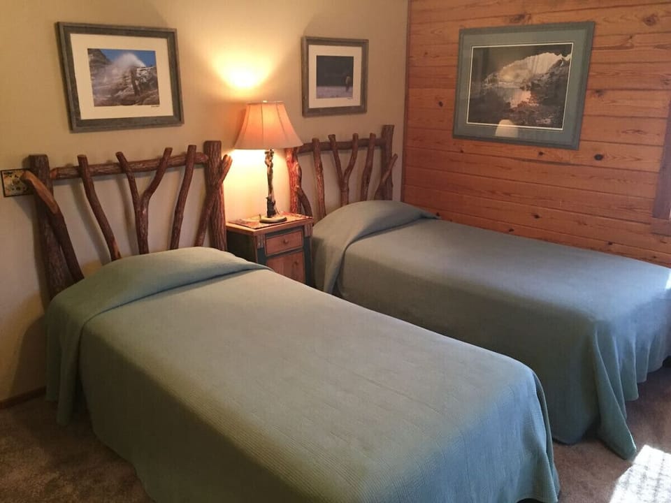 Our cozy cave themed bedroom with 2 extra long twins, dresser and closet.