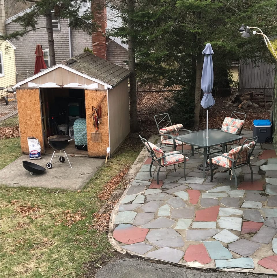 Flagstone patio with furniture, Webber, tools, cooler Offers great outdoor fun. 