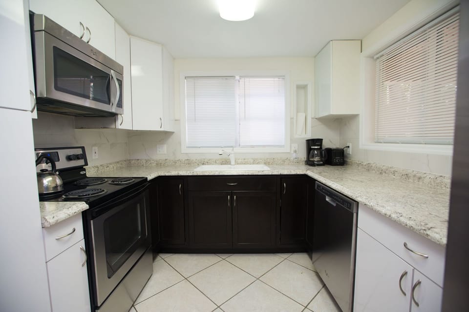 Past your dining area is the kitchen. Includes built in microwave, dishwasher.