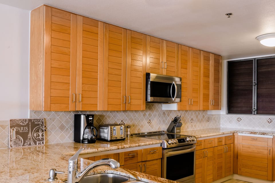 All new stainless steel appliances and Hawaiana style cabinets