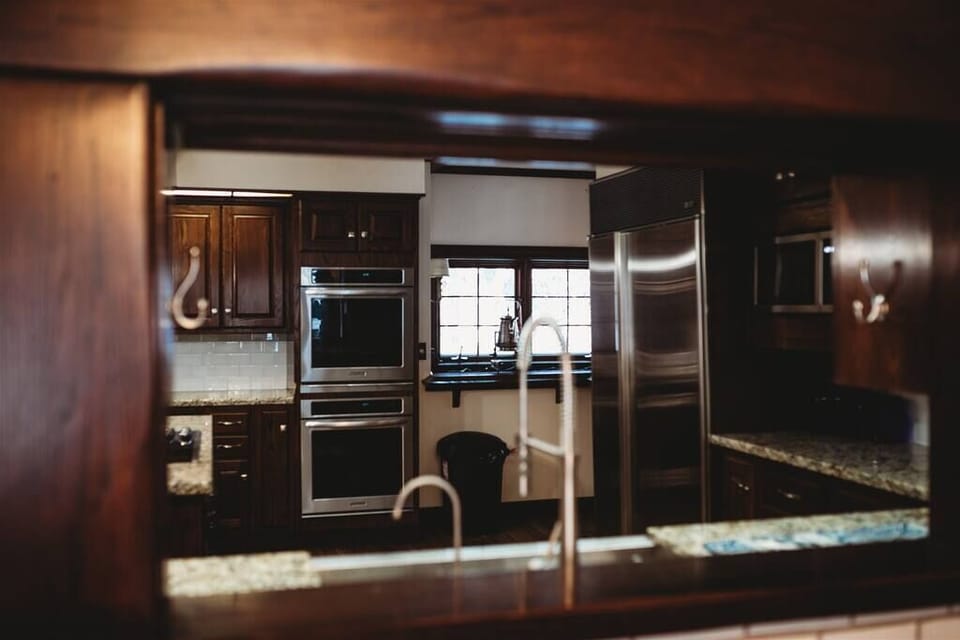 Luxurious kitchen design blending rustic charm with state-of-the-art features, perfect for creating culinary memories.