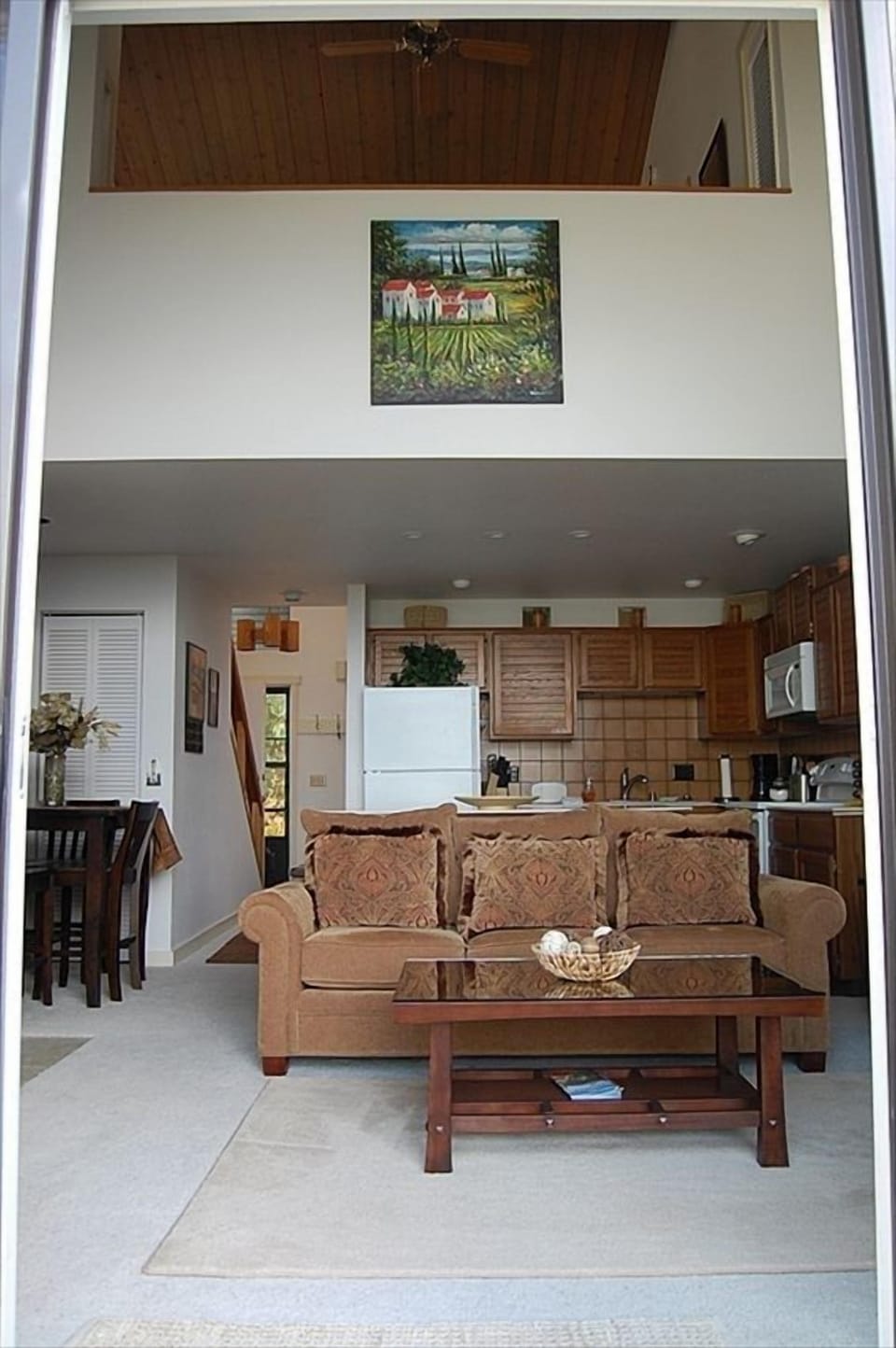 Living room with loft bedroom above