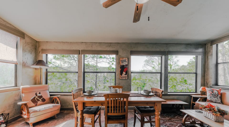 Sunroom with futon and dining table. What a view!