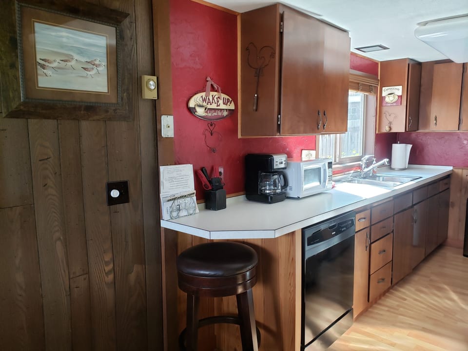 kitchen, gas stove and refrigerator to the right
