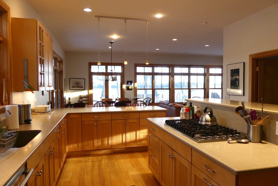 Kitchen view looking towards the dining area and windows looking over the water