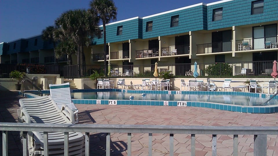 View of the building from the pool.  CDM-23 is a unit with the upper 2 floors.