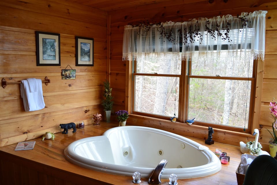 Soak your cares away in the private heart-shaped Jacuzzi tub in the master suite