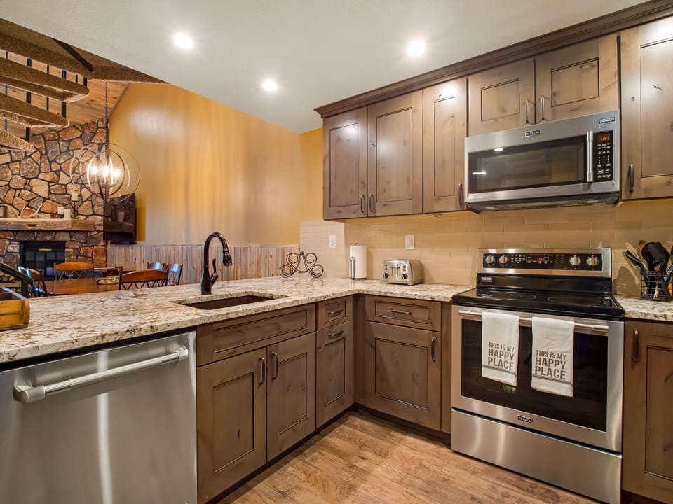 Kitchen is well appointed with all new cabinets, granite counters and appliances