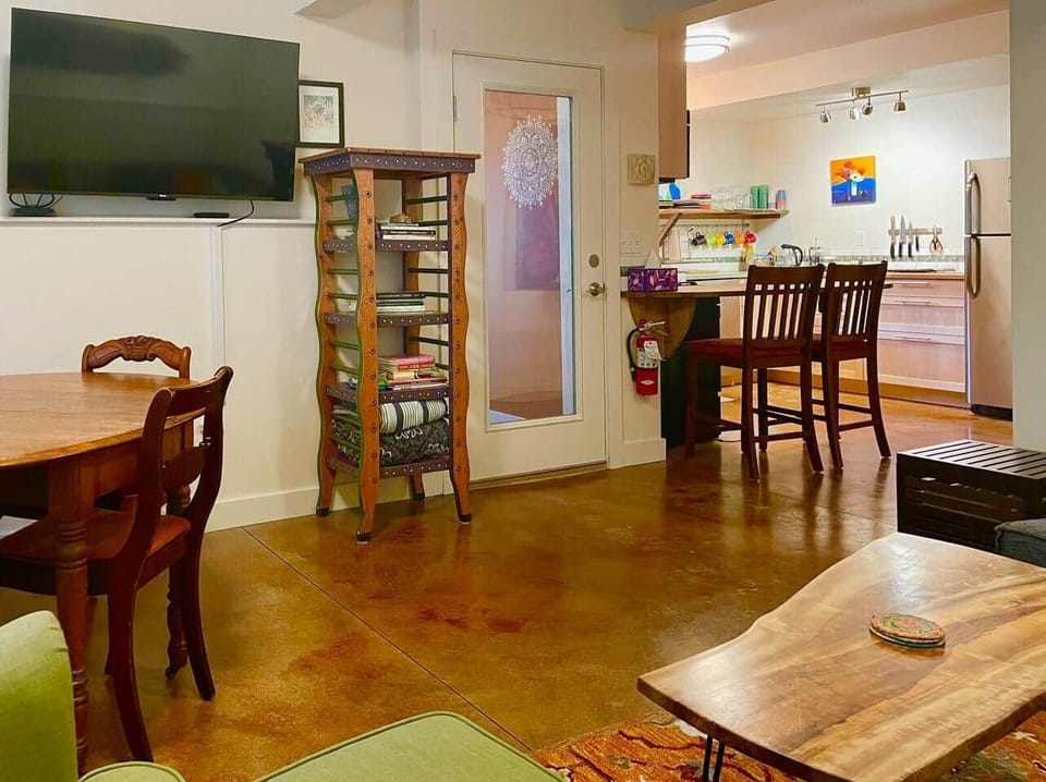 Open floor plan: Looking into the kitchen area from the dining/living space. 50” Smart RokuTV, new in 2025. 