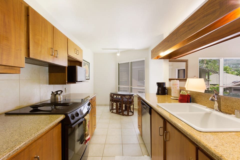 Large Kitchen w Granite Countertops and Koa Wood Cabinets