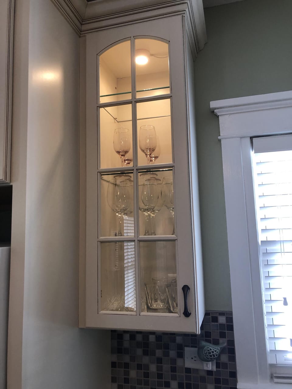 Glass pane cabinets with decorative lighting