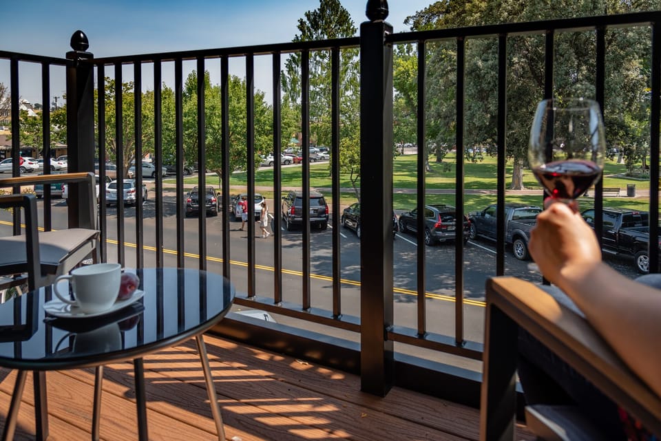 Unwind on the balcony with rail shadows and fresh air