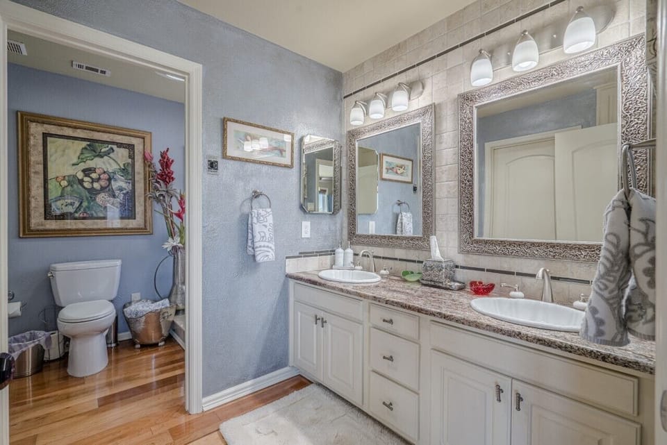 Double vanity in master bathroom.   Whirlpool and shower together. 