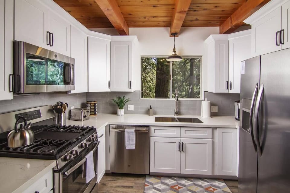 Main Level | Kitchen- Stunning collaboration of stainless, stone & hardwood