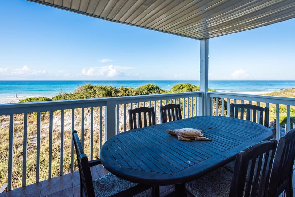 Middle floor balcony with outdoor dining table and six chairs