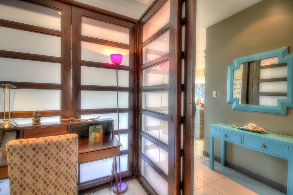 - Private workspace with warm lighting and modern design   - Frosted glass doors add privacy and contemporary flair   - Perfect for remote work or relaxing Costa Rica stays