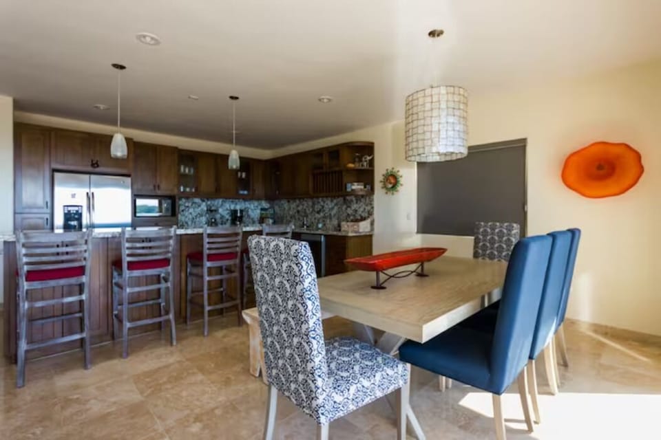 A view of the dining room & kitchen.