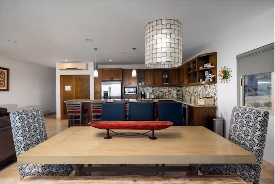 Looking at the dining room table & kitchen.