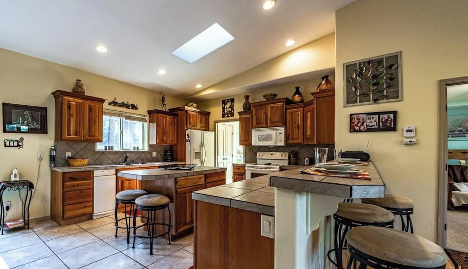 Kitchen is spacious and has bar seating.