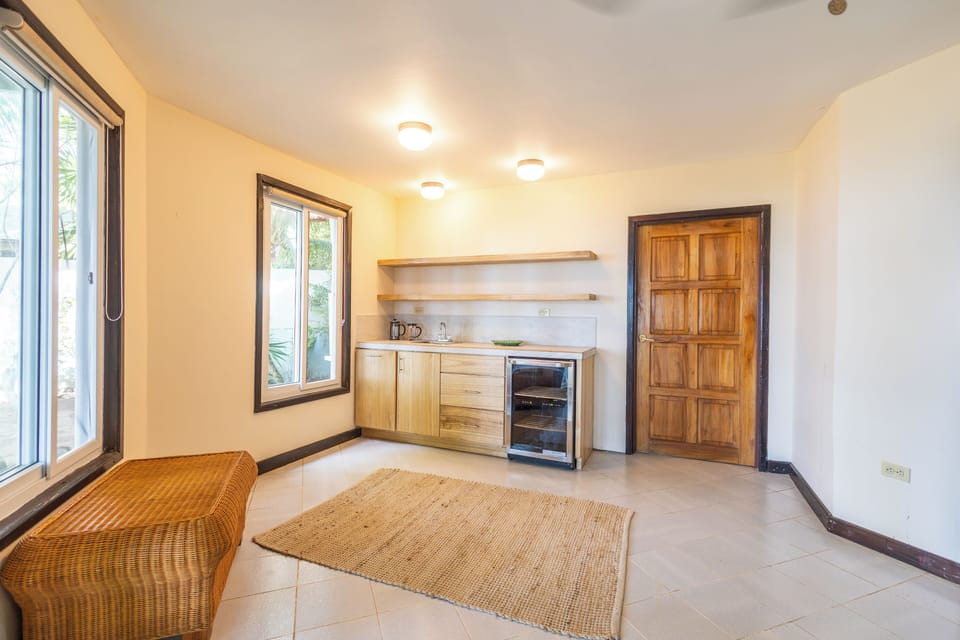 Downstairs Kitchenette - Wine Cooler and Coffee Maker. Door to Master Bed #2.