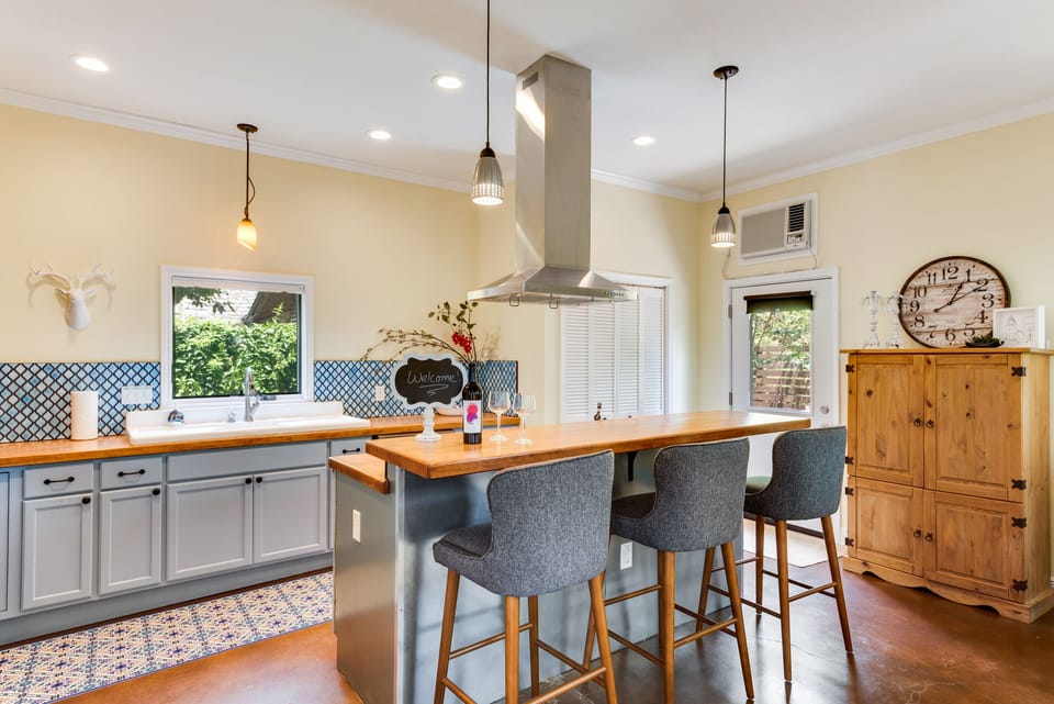 The breakfast bar is perfect for visiting or can be used as a work space.