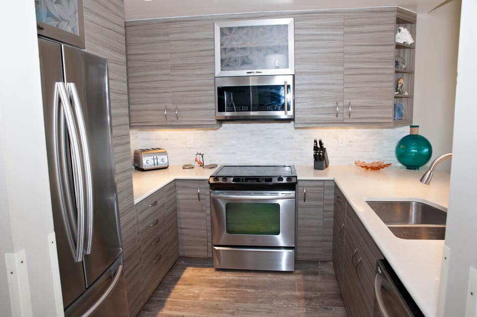 Bright, open gourmet kitchen with stainless steel appliances